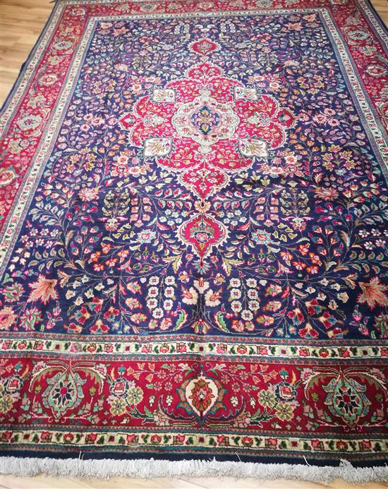 A Tabriz blue ground carpet 340 x 253cm